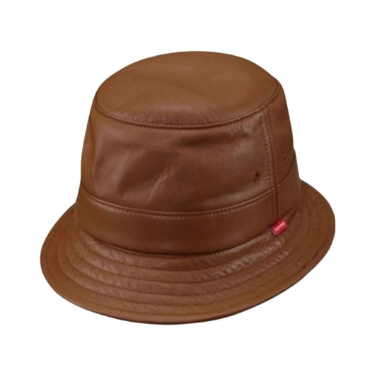 A brown faux-leather bucket hat with a small red brand tag on the side, shown against a plain white background.